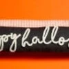"Happy Halloween" Glow In The Dark Skinny Rope Pillow By Mud Pie
