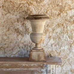 Aged Metal Urn By Porch View Home (Pick Up Only)
