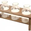 Wooden Flower Stand With Three Large Bottles By Porch View Home