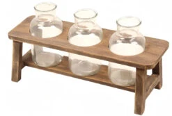 Wooden Flower Stand With Three Large Bottles By Porch View Home