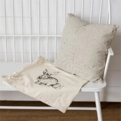 Striped Pillow With Tied Rabbit Slip Cover